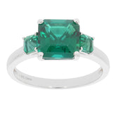 Green emerald sterling silver ring with accent stones, showcasing elegance and luxury in jewelry.